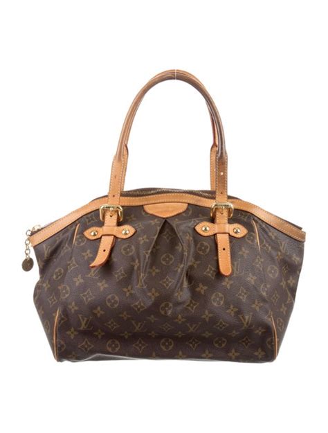 donna in giro con la louis vuitton tivoli gm|Louis Vuitton Monogram Tivoli PM/GM Bag Reference Guide.